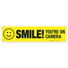 Smile You're On Camera Sign, Yellow Background With Smile Smile You're On Camera Sign, Yellow Background With Smile