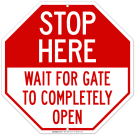 Stop Here Wait For Gate To Completely Open Sign